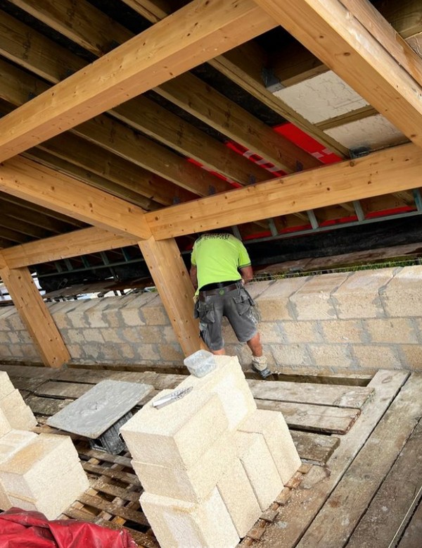 Hempcrete blocks being laid in the roofspace
