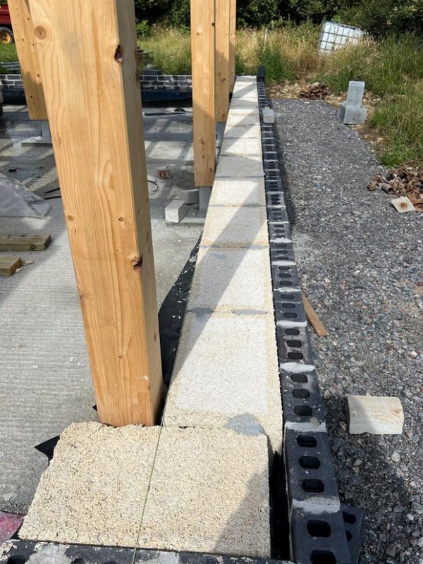 A row of hempcrete blocks being laid